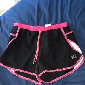 Black and pink athletic shorts